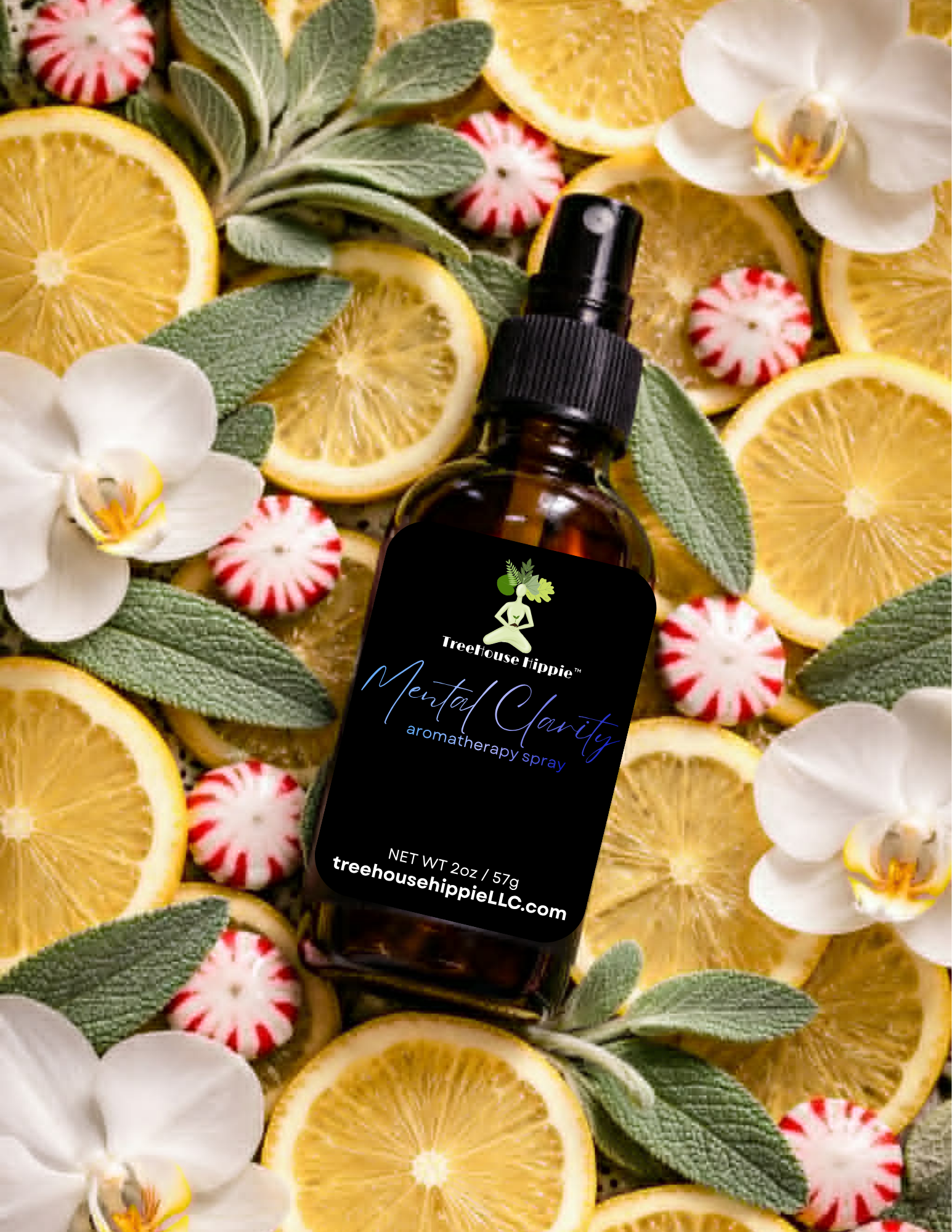 A bottle of TreeHouse Hippie's 'Mental Clarity' Aromatherapy Room & Body Spray surrounded by lemons, flowers, sage leaves, and peppermints on a green leafy background.